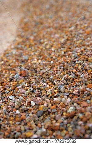Small Gravel With Brown Cement Background