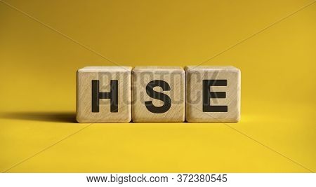 Hse Text On A Yellow Background On Wooden Cubes
