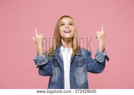 Cheerful Little Blonde Kid Girl 12-13 Years Old In Denim Jacket Isolated On Pastel Pink Background C