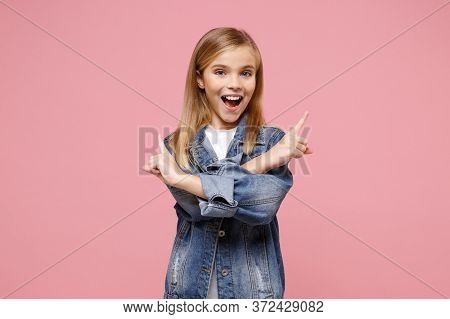 Excited Little Blonde Kid Girl 12-13 Years Old In Denim Jacket Isolated On Pastel Pink Background. C