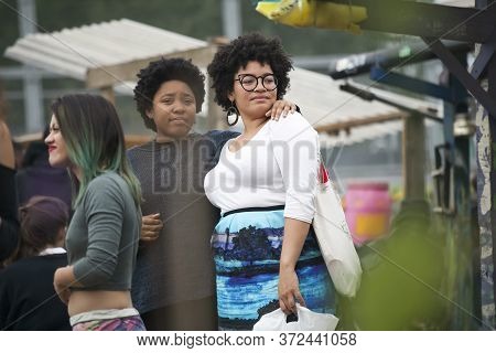 London, Uk - 17 July 2019, Nomadic Community Garden. Communal Garden Party. Two Fashionable Friends 