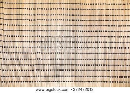 Mat Background Woven From Seaweed With A Bright Expressive Pattern Of Yellow Stitched With Black Syn