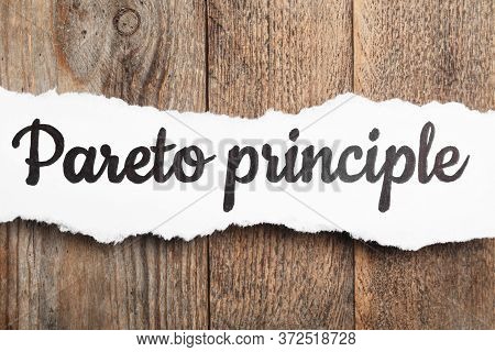 Sheet Of Paper With Words Pareto Principle On Wooden Background, Top View
