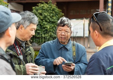 Yunnan, China February 2019. Inhabitants Of A Rural Village Amazed By The Presence Of Western Touris