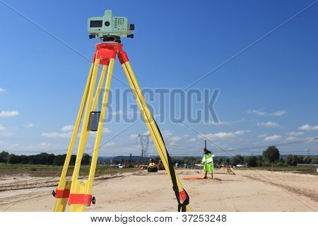 Geodesist Taking Measurement