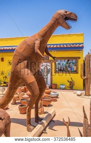 Usa, Arizona 28,06,2016 Dinosaurs And Other Metal Figures Are On Sale In The Street Next To A Mexica