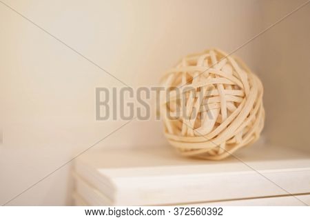 The Brown Balls Wicker From Willow Twigs Put On The Pile Of Book, For Background Or Back Drop, And D
