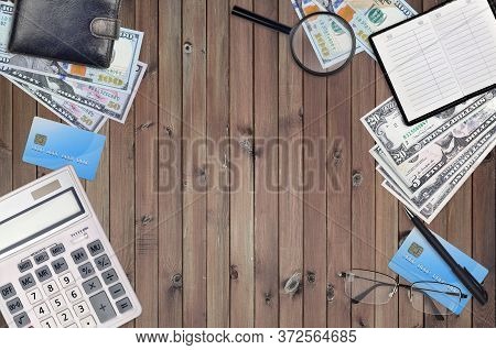 Office Flat Lay Composition With Calculator, Address Book And Other Office Items On Brown Wooden Tab