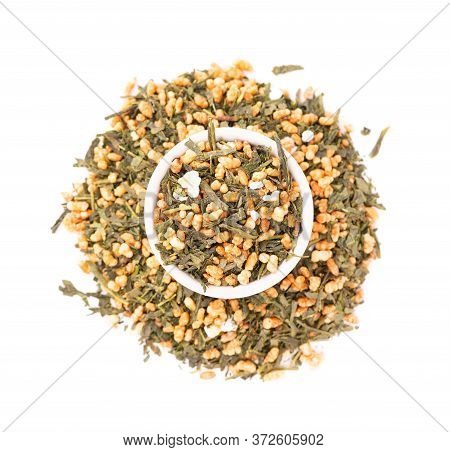 Japanese Green Tea Genmaicha, Isolated On White Background. Tea Leaves With Roasted Brown Rice. Orga