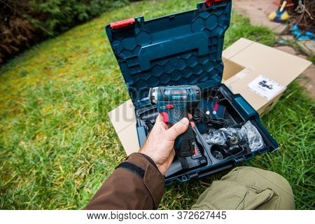 Paris, France - Feb 23, 2020: Male Hand Holding New Bosch Gsr 12v-15 Fc Professional Cordless Drill 