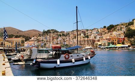 Symi, Greece - June 21, 2020: Symi Town, Symi Island, Pictorial View Of Colorful Houses And  Yialos 