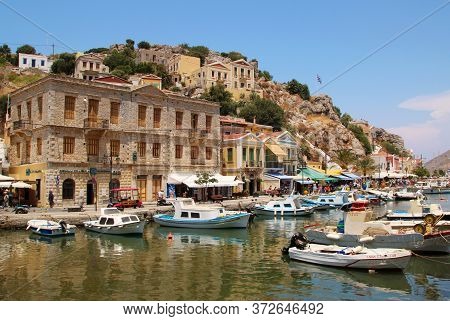 Symi, Greece - June 21, 2020: Symi Town, Symi Island, Pictorial View Of Colorful Houses And  Yialos 