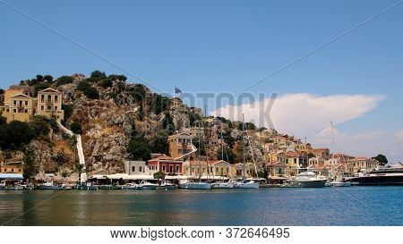 Symi, Greece - June 21, 2020: Symi Town, Symi Island, Pictorial View Of Colorful Houses And  Yialos 