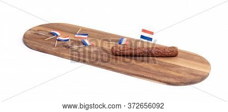 Wooden Tray With Just One Frikadel Left, A Dutch Fast Food Snack, Isolated