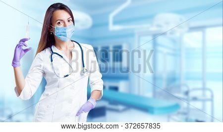 Asisstant Doctor In Operating Room. Light Background.