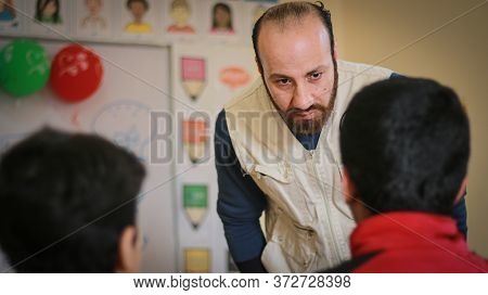 Aleppo, Syria 18 April 2020
A Teacher Scolds His Students In School