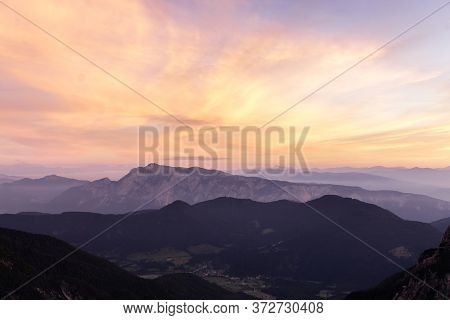 Mountain Landscape At Sunset In Julian Alps. Amazing View On Colorful Clouds And Layered Mountains S