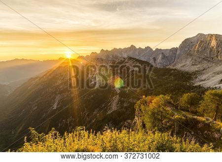 Amazing Sunrise In The Mountains. Backlight Sunlight With Beautiful Lens Flares And Sunbeams. Julian