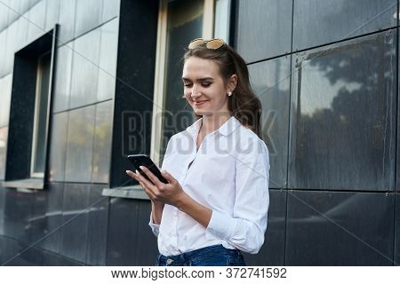 The Business Girl With Phone. The Girl Gets A Plessure Message