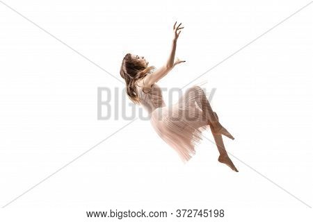 Mid-air Beauty Cought In Moment. Full Length Shot Of Attractive Young Woman Hovering In Air And Keep