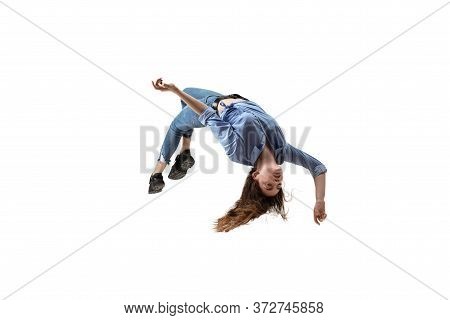 Mid-air Beauty Cought In Moment. Full Length Shot Of Attractive Young Woman Hovering In Air And Keep