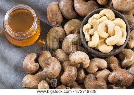 Walnuts And Cashew Oil On The Table - Anacardium Occidentale. Marañón
