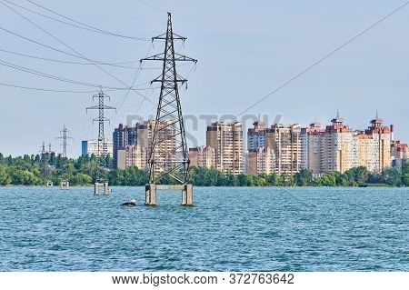 Overhead Power Line Over River. High-voltage Power Line. Transmission Tower, Distribution. Multistor
