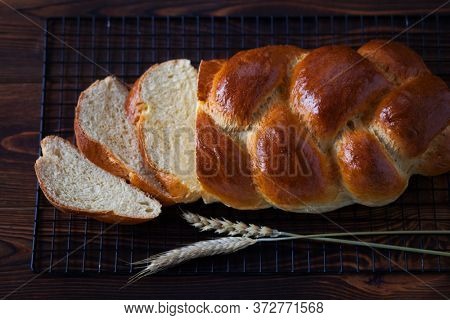 homemade challah on wooden background - food and drink