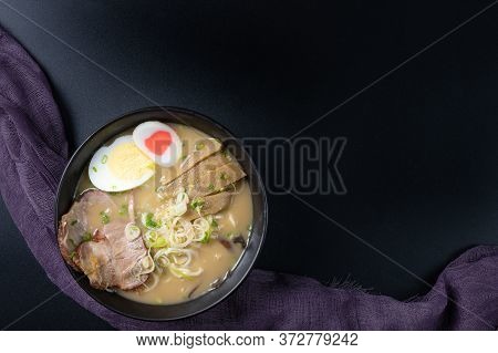 Delicious Tonkotsu Ramen, Japanese Noodle In Pork Bone Based Soup Topped With Chashu Pork, Boiled Eg