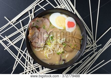 Delicious Tonkotsu Ramen, Japanese Noodle In Pork Bone Based Soup Topped With Chashu Pork, Boiled Eg