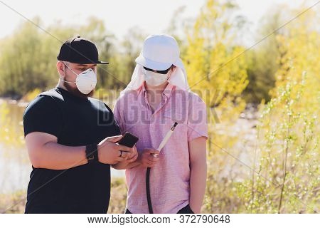Man Smoking Shesha, Hookah Near The Lake Alone.
