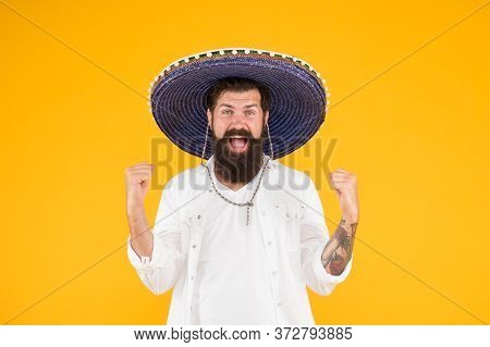 Happy Brutal Male Celebrating Fiesta. Guy Wear Poncho. Sombrero Party Man. Man In Mexican Sombrero H