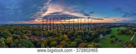 Impressive Sunrise Over Munich - Drone Shot Over The Englischer Garten Of The Bavarian Capital As Gr