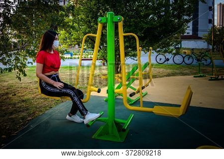 A Colombian Student In Brazil Making Exercise Outsite Using Mask To Prevent The Covid-19