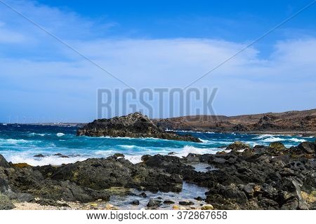 Arikok Natural Park On The Island Of Aruba In The Caribbean Sea With Deserts And Ocean Waves On The