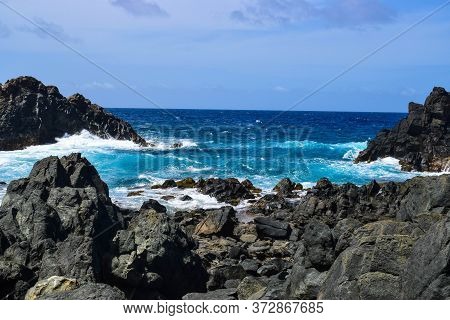 Arikok Natural Park On The Island Of Aruba In The Caribbean Sea With Deserts And Ocean Waves On The