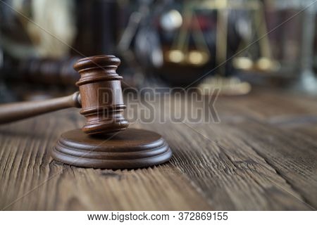 Lawyers Office Concept. Law Symbols Composition - Gavel And Themis Statue On  Wooden  Desk.