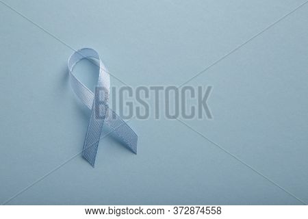 Prostate Cancer Awareness Blue Ribbon. Men Health Care Concept, Background With Pills