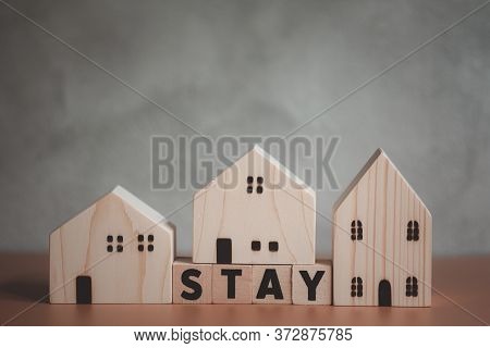 Stay Wooden Letters With Wooden Home. Concept Of Stay Home Stay Saft Quarantine And Warning