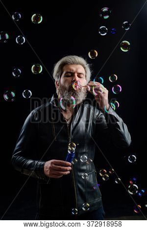 Man Blowing Bubbles. Soap Bubbles. Play With Bubbles. Bearded Man Blowing Soap Bubbles. Happiness. G