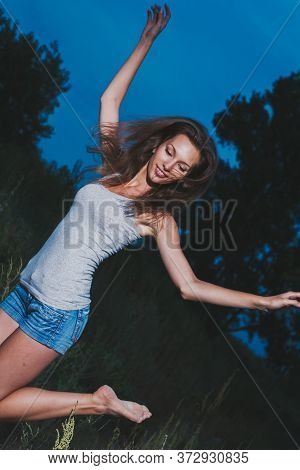 Girl Is Dancing Extaticly In The Dark, 90s Soap-box Style Philm Photo Imitation