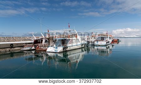 Akdamar Island, Van, Turkey - February 2020: Tour Boats In Harbour To Akdamar Island And Surp Church