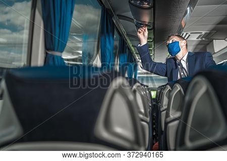 Caucasian Coach Bus Driver In His 40s Preparing Vehicle For The Next Trip Of The Day. Public Transpo
