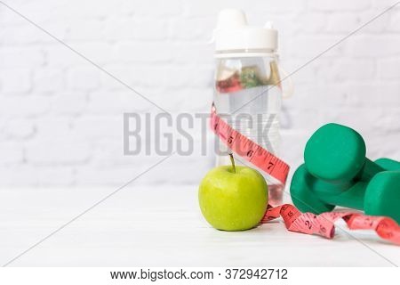Diet Health Food And Lifestyle Health Concept. Sport Exercise Equipment Workout  and Gym Background 