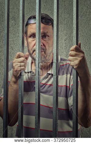 Accused Mature Adult Man In A Criminal Case Is Placed Into A Pre-trial Detention Cell