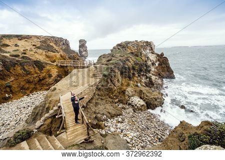Father And Little Son Admiring Nature In Peniche, Portugal