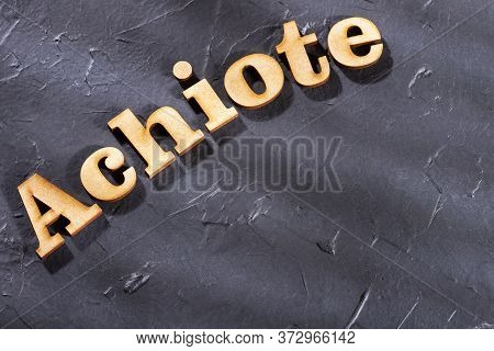 Word Achiote In Wooden Letters - Bixa Orellana