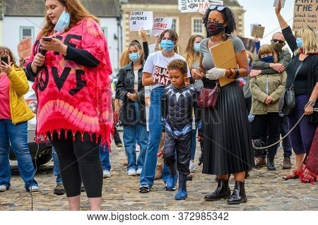 Richmond, North Yorkshire, Uk - June 14, 2020: A Powerful Black Female Leader Wears A Black Lives Ma
