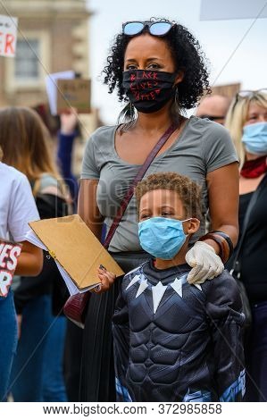 Richmond, North Yorkshire, Uk - June 14, 2020: A Strong Female Leader Wears A Black Lives Matter Ppe