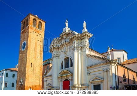 Chiesa Saint Andrea Catholic Church Building With Brick Bell Tower In Historical Centre Of Chioggia 